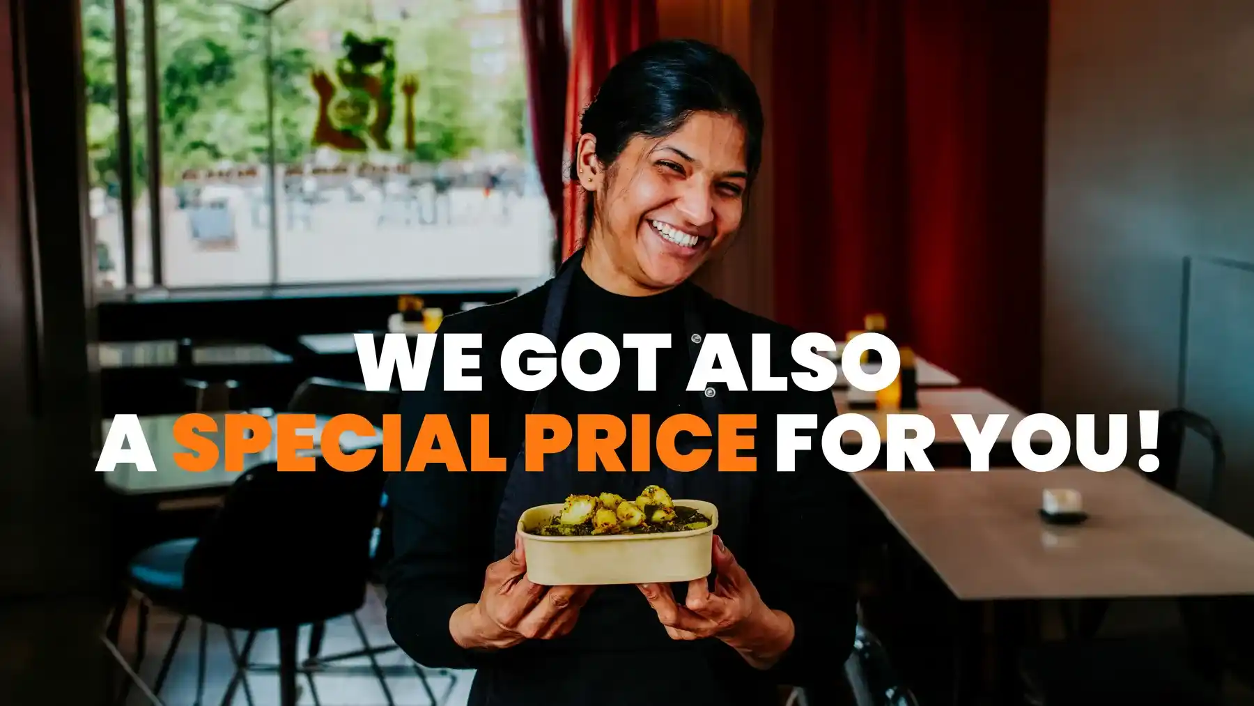 Bindia team member holding Spinach Aloo with a special price message